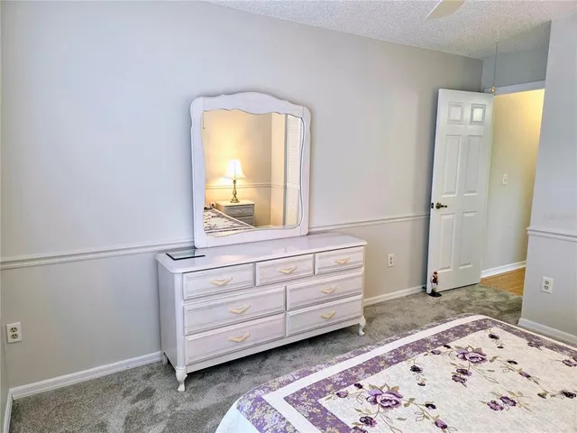 a bedroom with a bed and a window in it