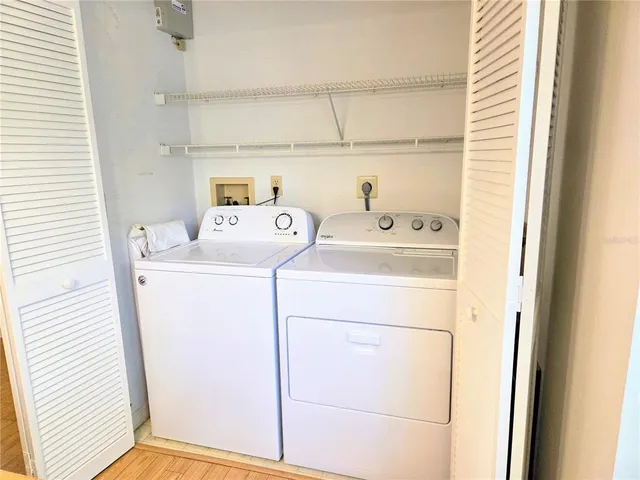 a living room with furniture a ceiling fan and a window