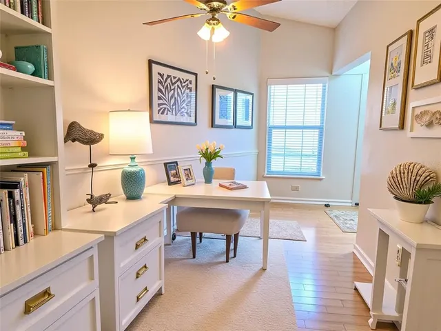 a view of a kitchen and dining room with windows