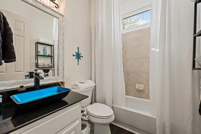 a living room with furniture a fireplace and a window
