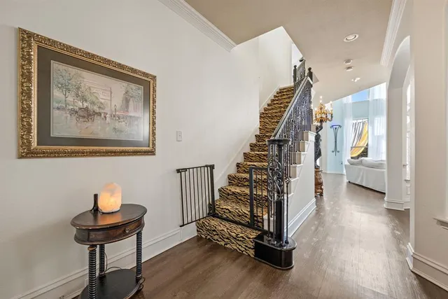 a view of an entryway with wooden floor