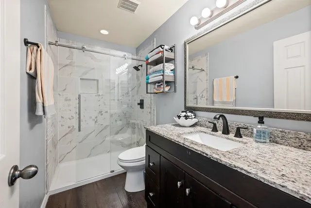 a bedroom with bed and a window