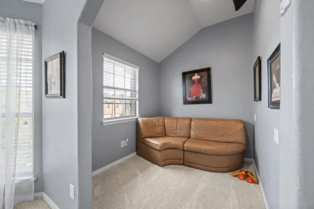 a view of backyard with seating space and trees