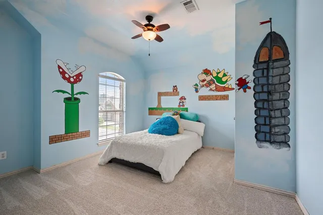 a backyard of a house with table and chairs