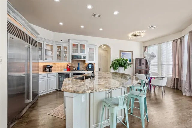 a kitchen with a table and chairs in it