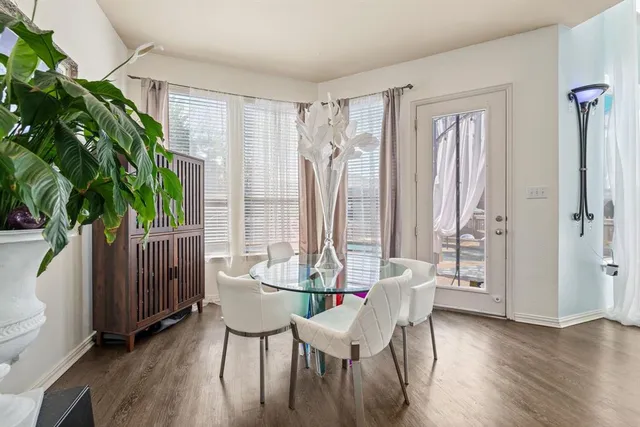 a kitchen with stainless steel appliances granite countertop a stove refrigerator and cabinets