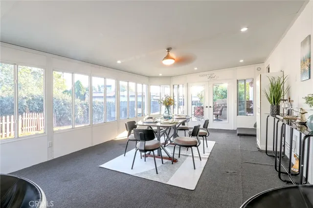 a view of a patio with a dining table and chairs