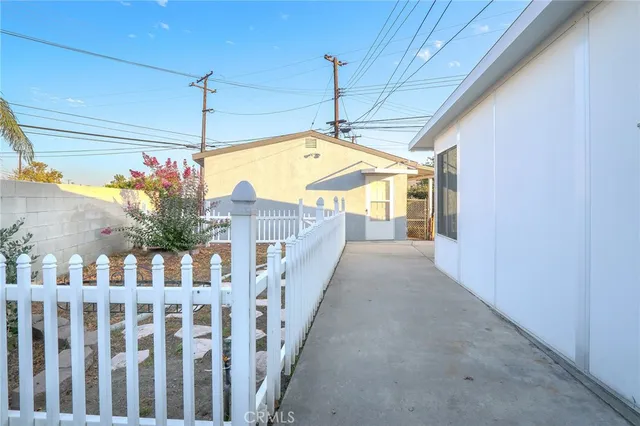 a living room with furniture and painting on the wall