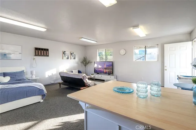 a front view of a house with a garden and yard