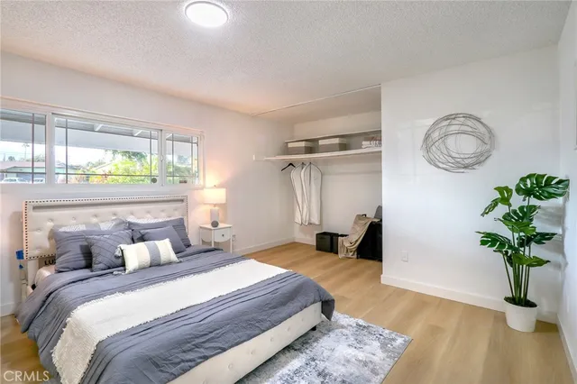 a bedroom with bed and a window