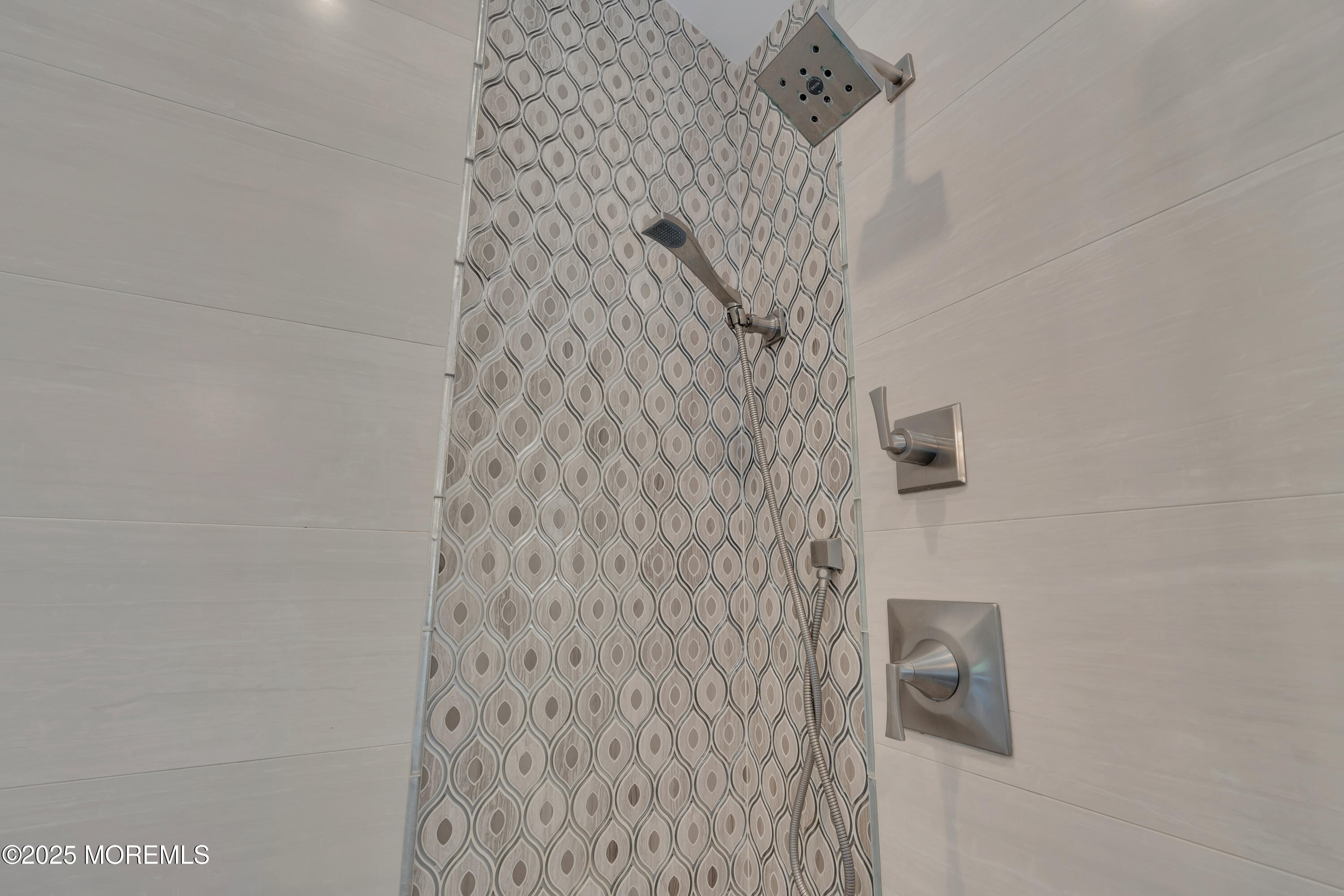 57 River Road Rumson, NJ 07760 - Photo 18 of 44 a bathroom with a shower curtain