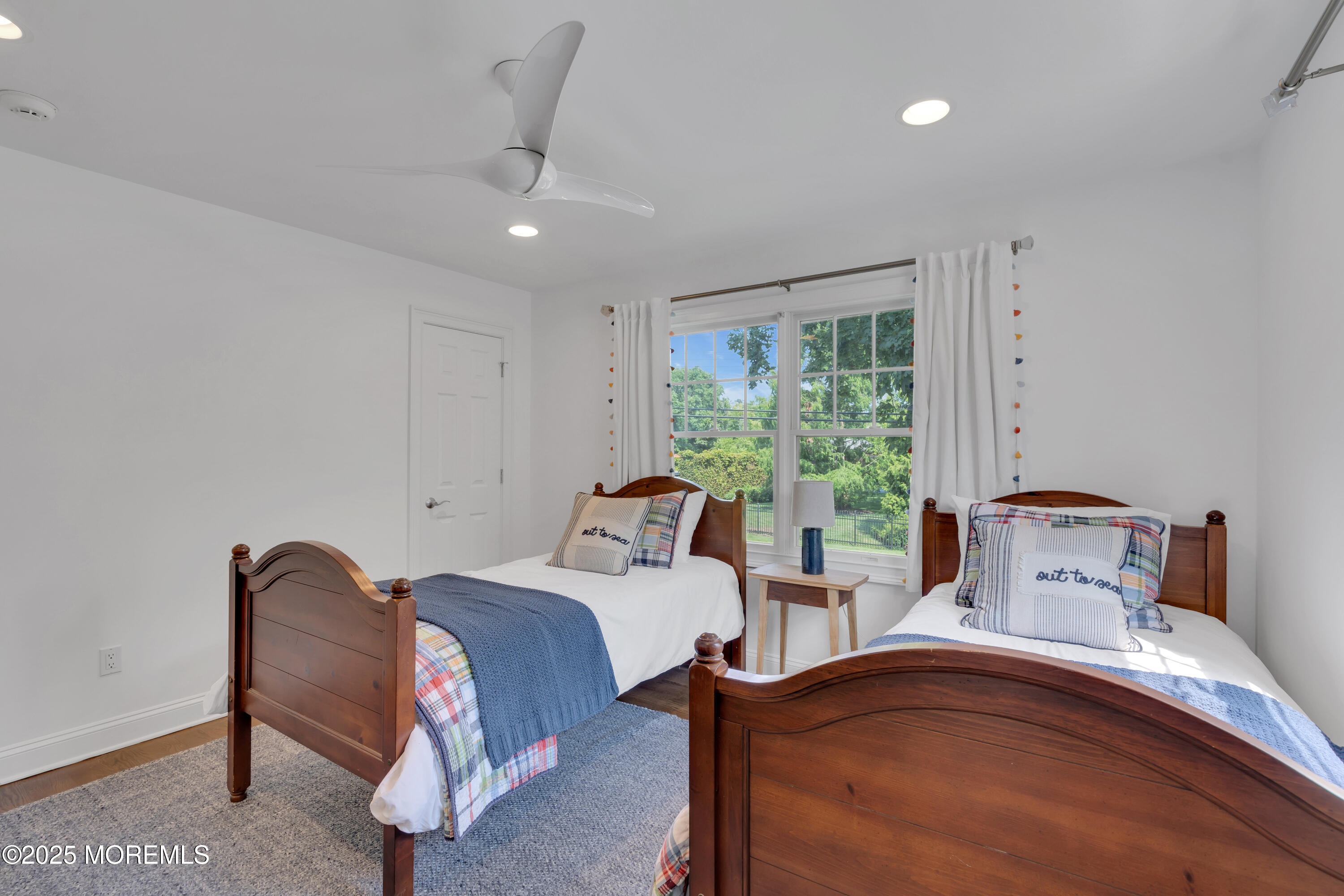 57 River Road Rumson, NJ 07760 - Photo 19 of 44 a bedroom with a bed and a window