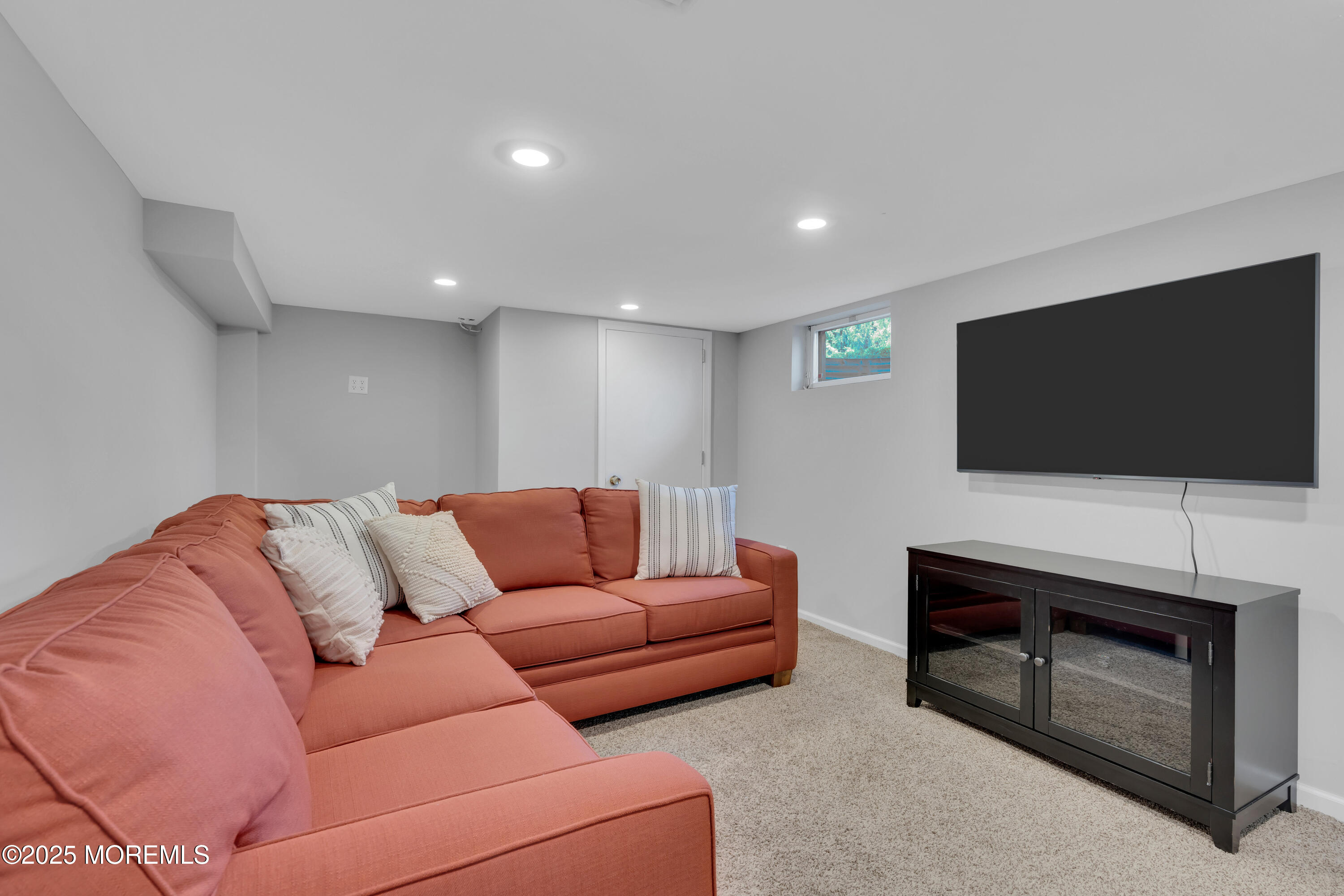 57 River Road Rumson, NJ 07760 - Photo 27 of 44 a living room with furniture and a flat screen tv