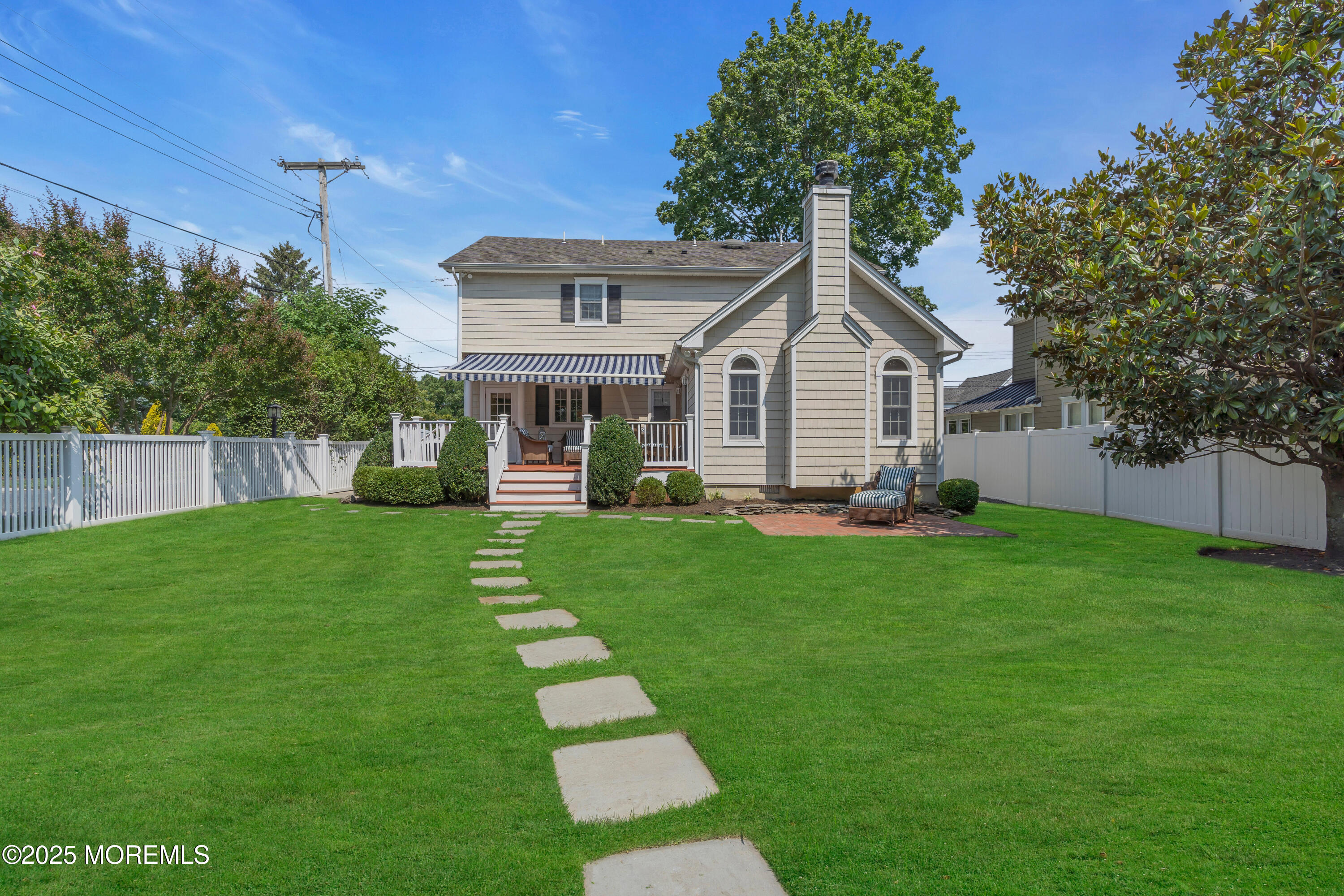 57 River Road Rumson, NJ 07760 - Photo 33 of 44 a front view of house with yard and green space