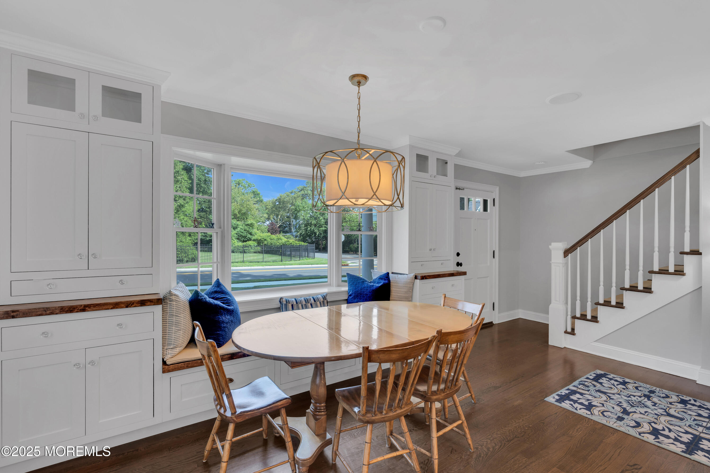 57 River Road Rumson, NJ 07760 - Photo 6 of 44 a dining room with furniture a chandelier and wooden floor
