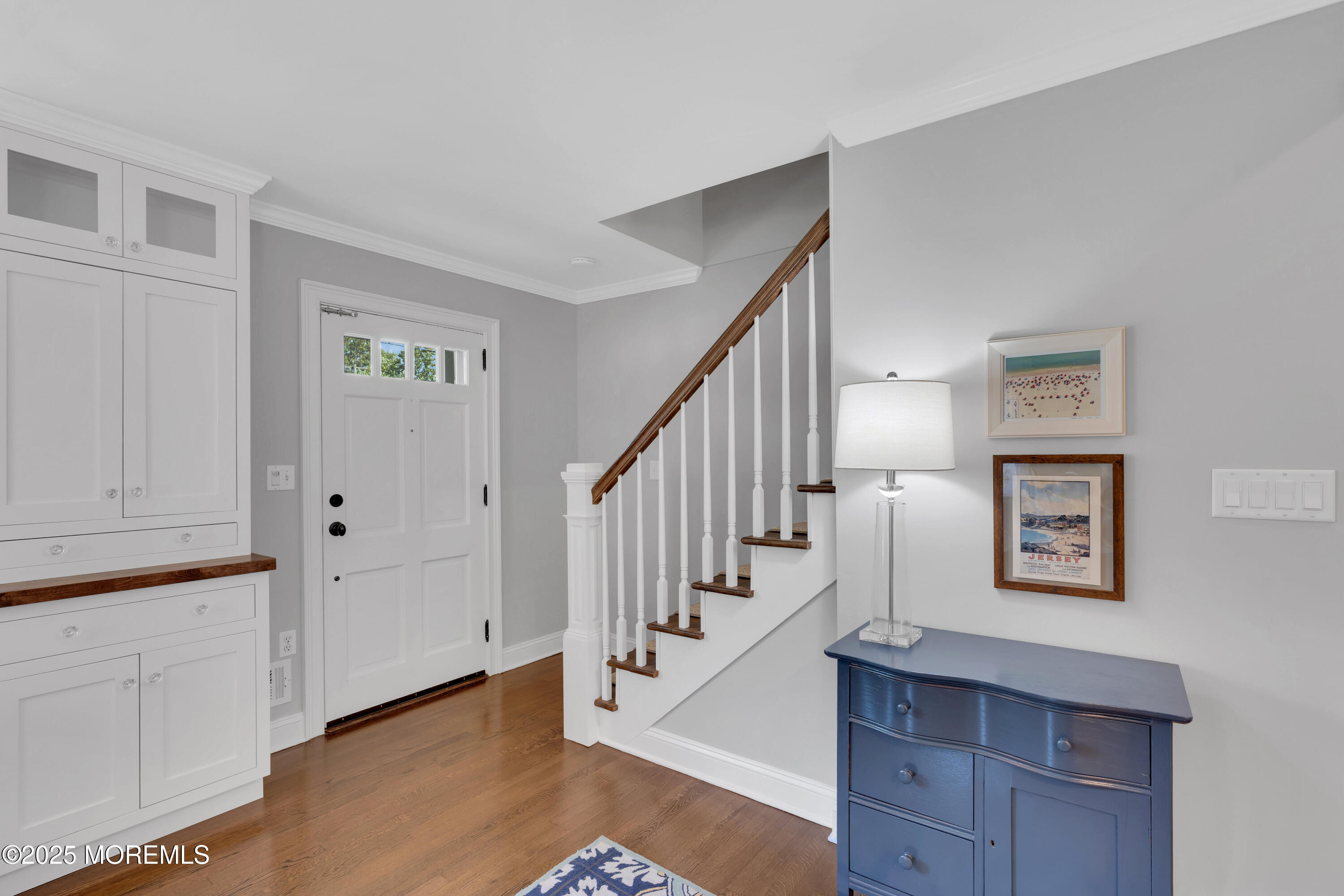 57 River Road Rumson, NJ 07760 - Photo 7 of 44 a view of entryway with stairs and wooden floor