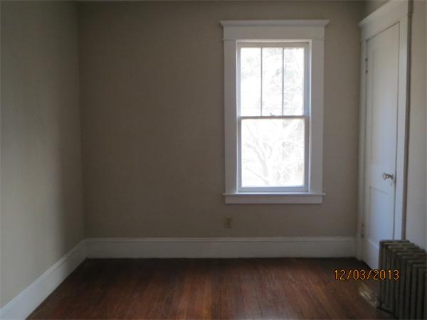 48 St James Circle Springfield, MA 01104 - Photo 5 of 8 a view of a small space with wooden floor and a window