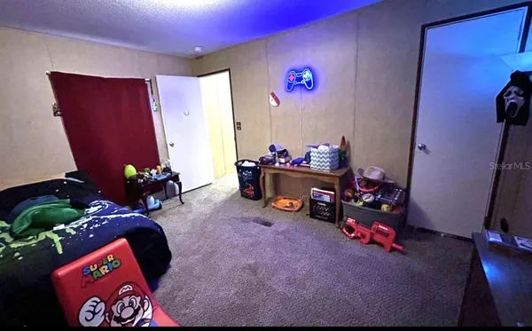 a bedroom with furniture and a potted plant