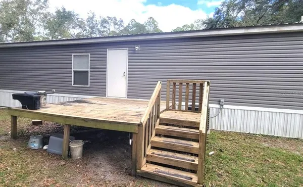 a view of a back yard from a balcony
