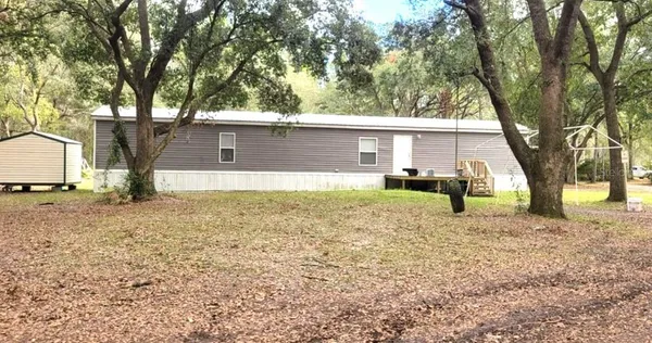 a house view with a backyard space