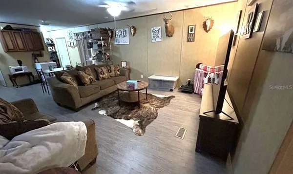 a living room with furniture and a window