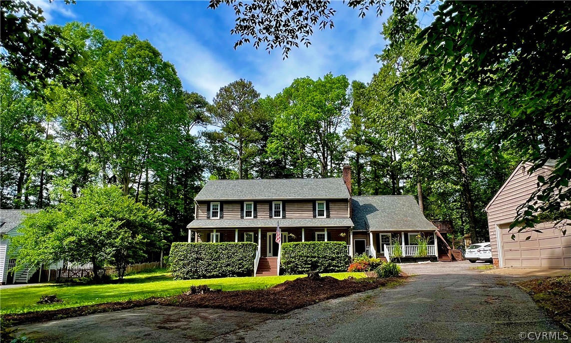 13604 Winterberry Ridge Midlothian, VA 23112 - Photo 1 of 50 a front view of a house with a garden