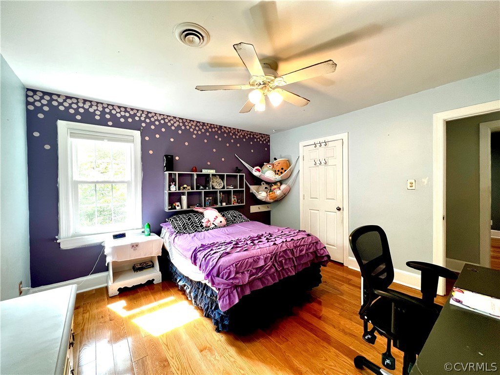 13604 Winterberry Ridge Midlothian, VA 23112 - Photo 33 of 50 a bedroom with a bed and a chandelier