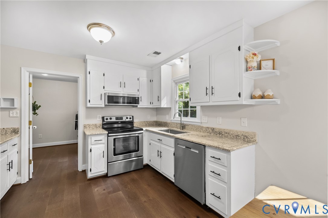 1144 Timber Trace Road Powhatan, VA 23139 - Photo 8 of 40 Kitchen featuring wood-finish flooring, white cabi