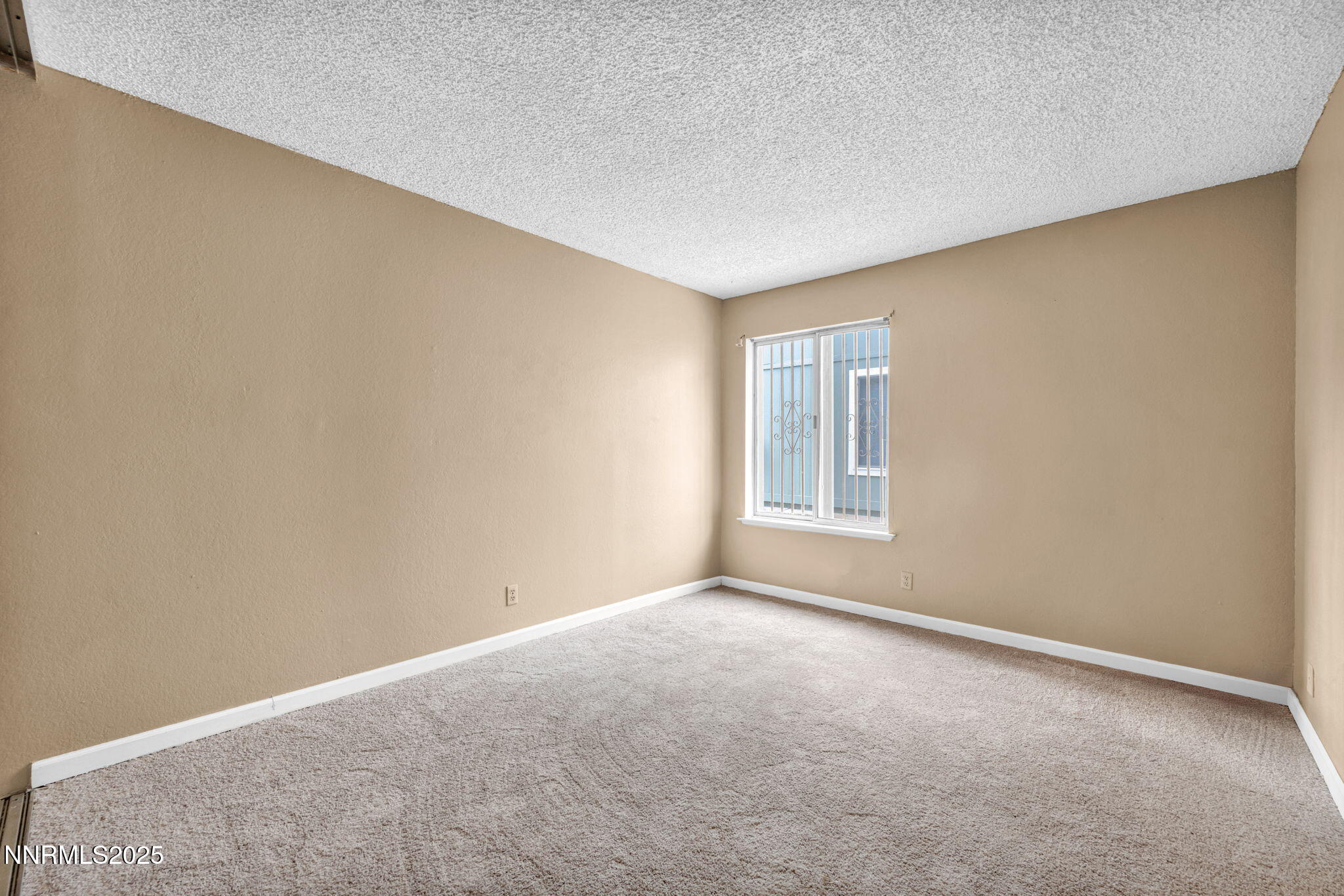 4600 Neil Road, Unit 35 Reno, NV 89502 - Photo 15 of 23 a view of an empty room with windows