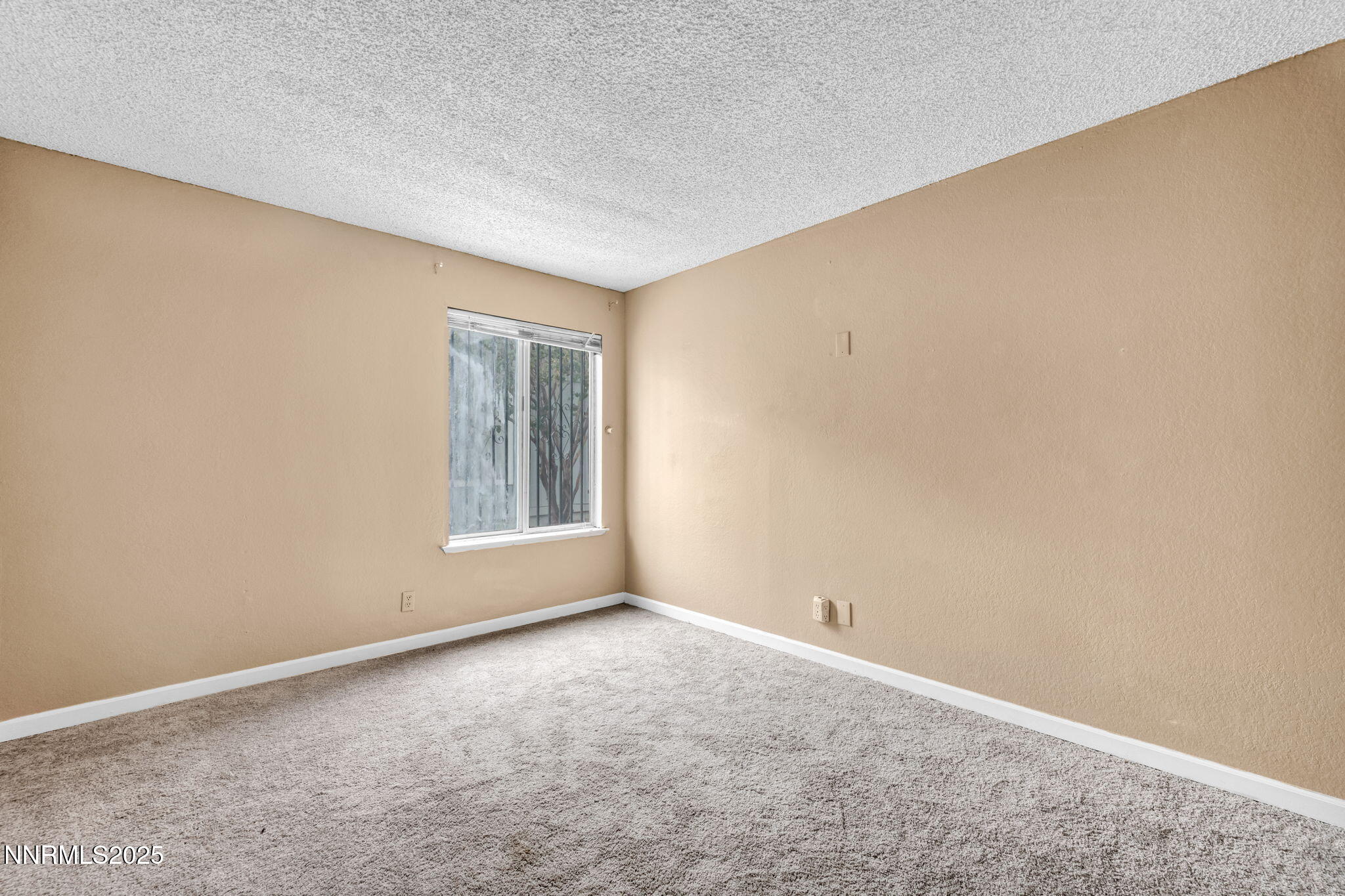 4600 Neil Road, Unit 35 Reno, NV 89502 - Photo 17 of 23 a view of an empty room with a window