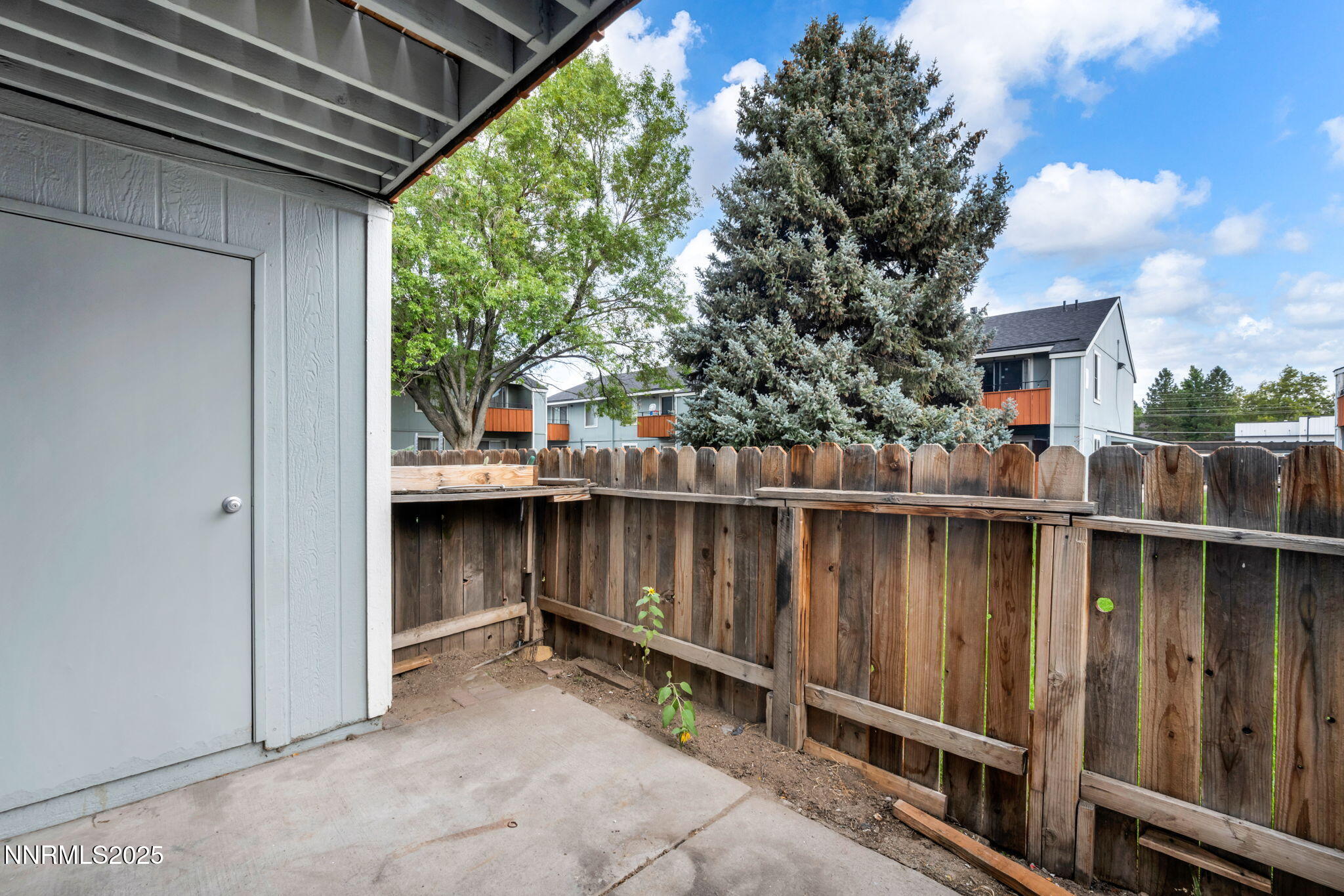 4600 Neil Road, Unit 35 Reno, NV 89502 - Photo 18 of 23 a view of a balcony with wooden floor and fence
