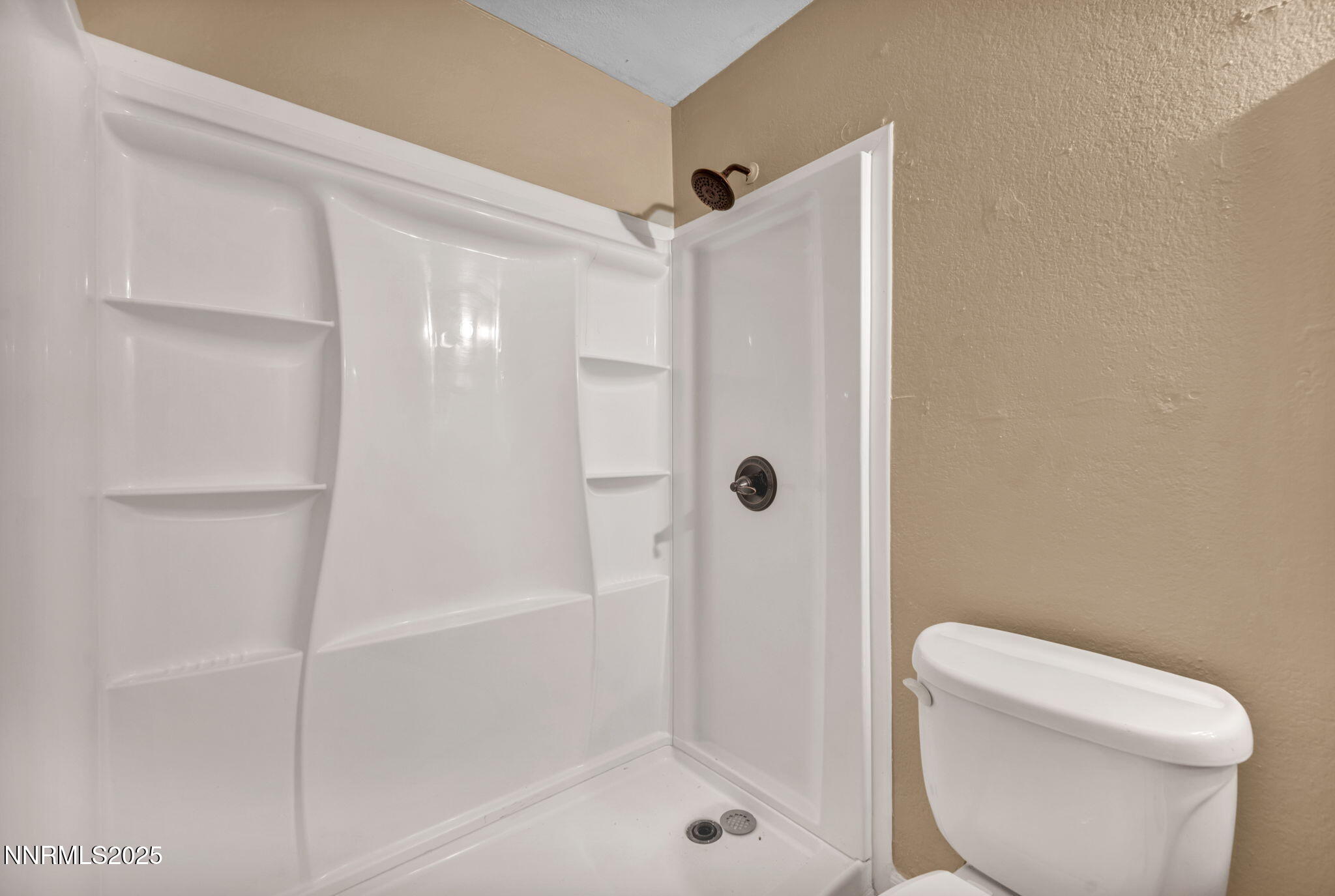 4600 Neil Road, Unit 35 Reno, NV 89502 - Photo 19 of 23 a bathroom with a toilet and shower