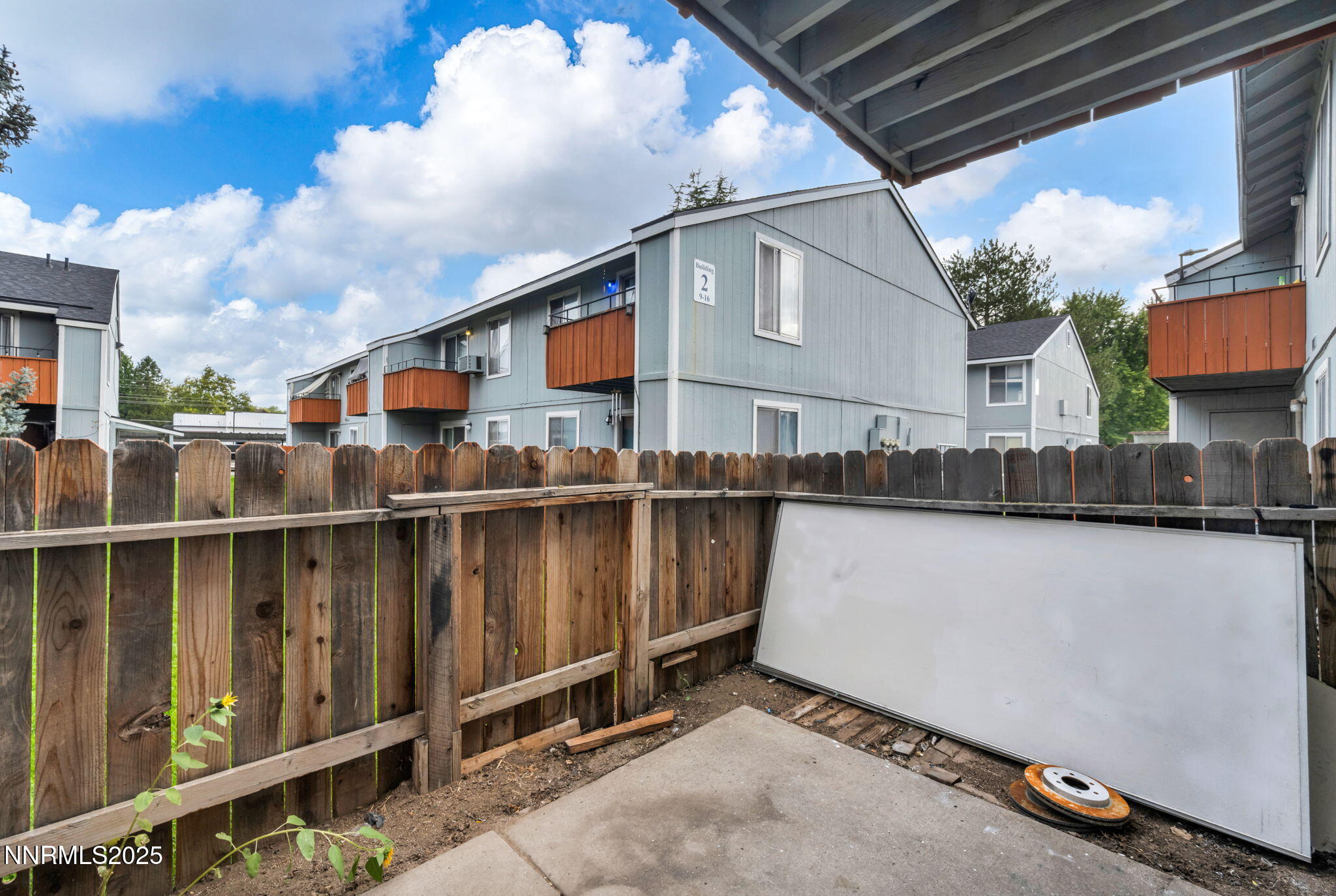 4600 Neil Road, Unit 35 Reno, NV 89502 - Photo 20 of 23 a view of a balcony with wooden fence