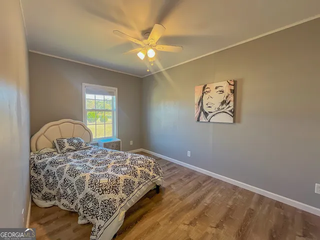 a bathroom with a sink a toilet a mirror and vanity