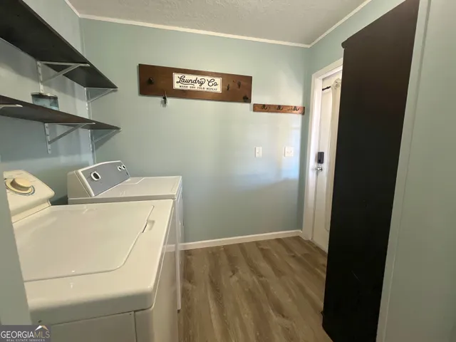 a bed sitting in a room next to a window