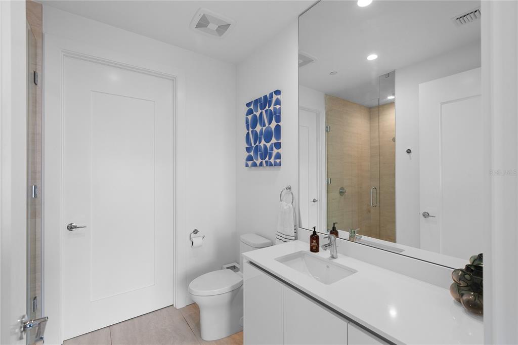 301 Quay Commons, Unit 509 Sarasota, FL 34236 - Photo 23 of 45 a bathroom with a sink and a mirror