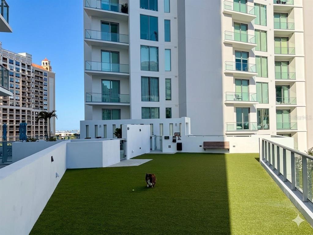301 Quay Commons, Unit 509 Sarasota, FL 34236 - Photo 30 of 45 a view of an apartment with a garden and deck