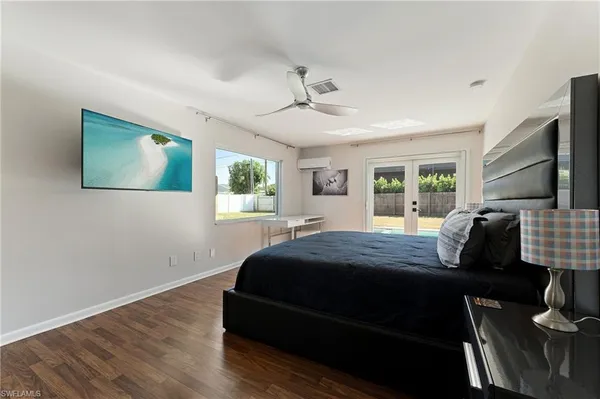 a bedroom with bed and window