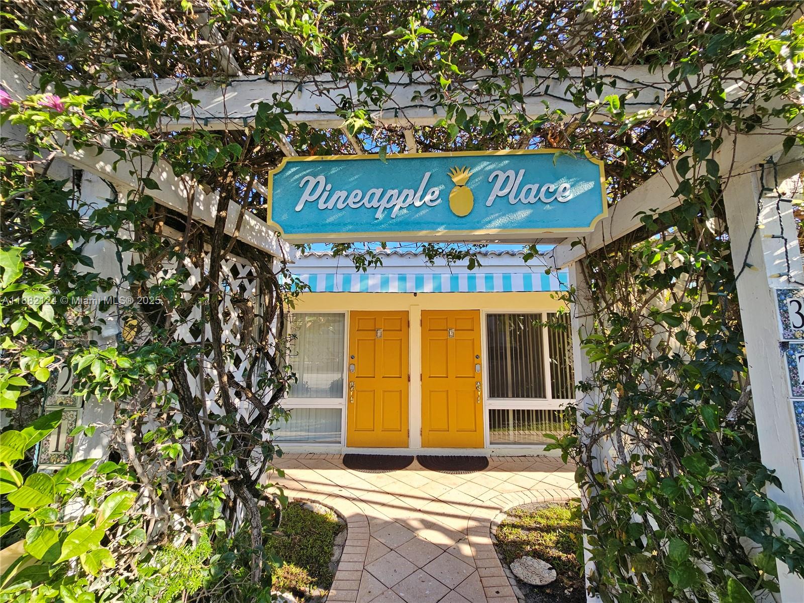 3217 Northeast 7th Place, Unit 2 Pompano Beach, FL 33062 - Photo 19 of 20 a sign on the side of a road