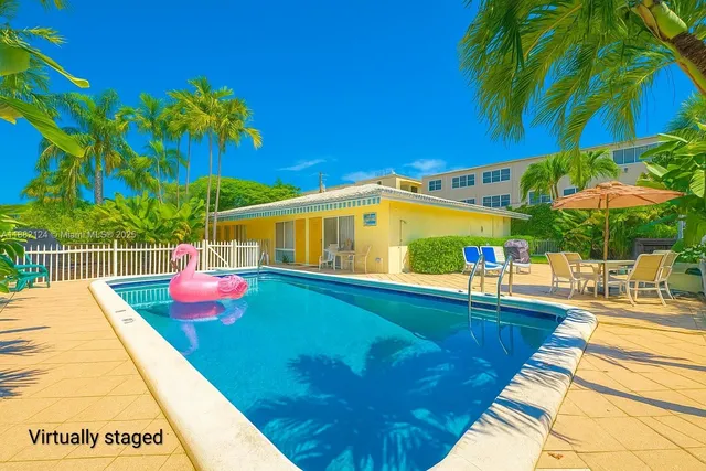 a view of a swimming pool with a patio