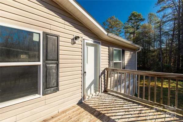 a view of a balcony with wooden floor