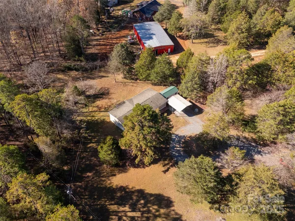 a aerial view of a house with a yard