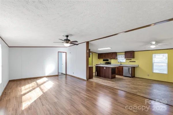 a view of kitchen with a sink and wooden floor