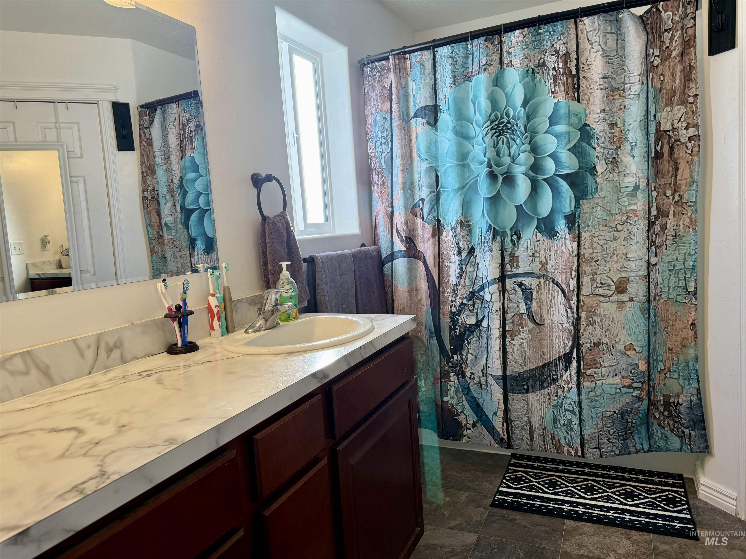 1141 Sunset Lane Kimberly, ID 83341 - Photo 5 of 6 Bathroom with vanity and a shower with shower curtain
