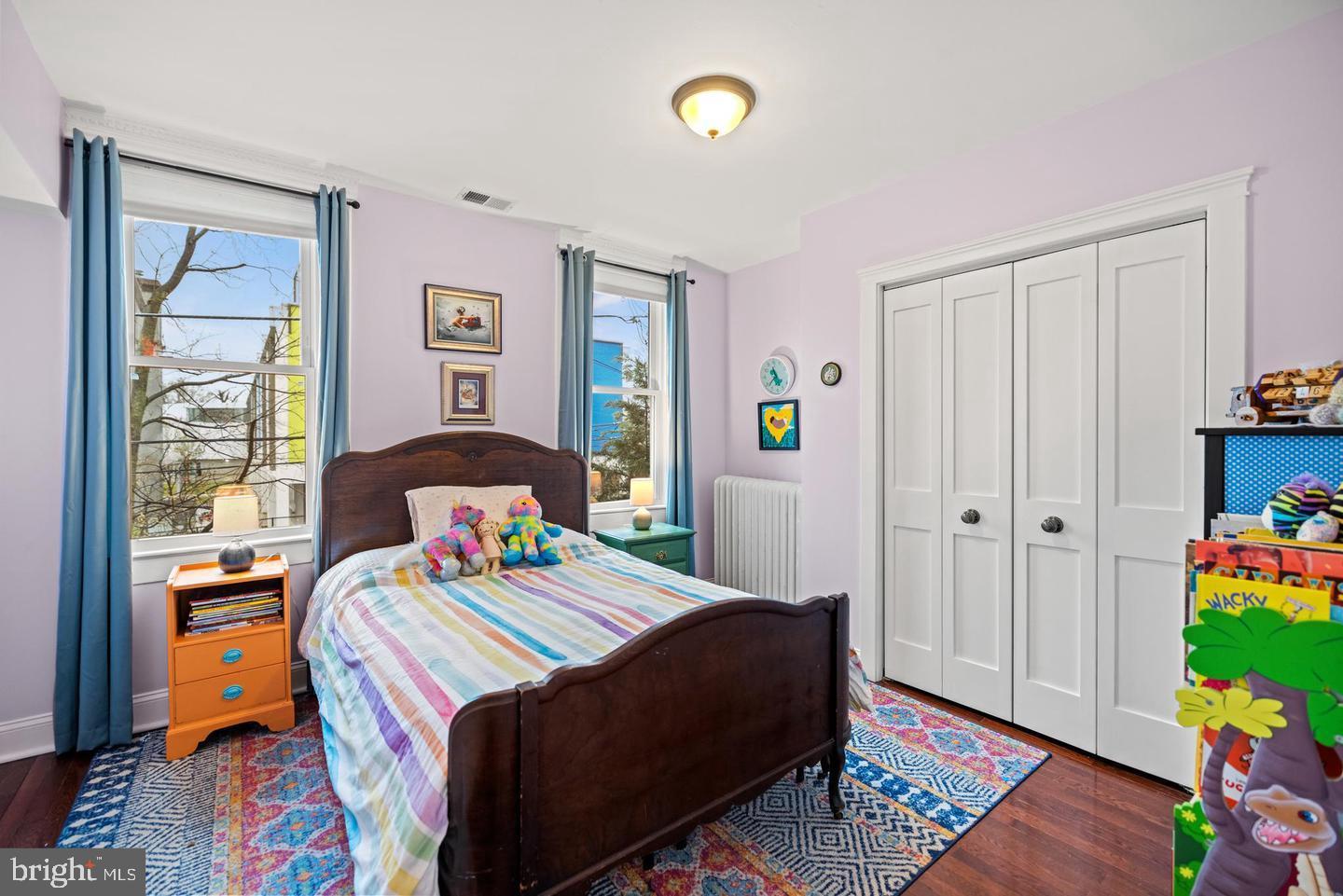 637 Allison Street Northwest Washington, DC 20011 - Photo 16 of 25 a bedroom with a bed and a window in it