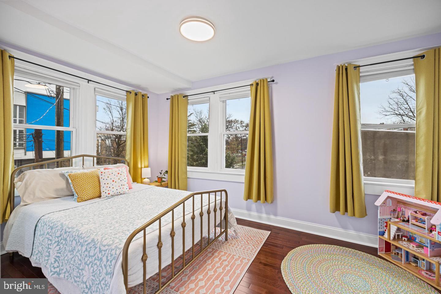 637 Allison Street Northwest Washington, DC 20011 - Photo 19 of 25 a bedroom with a bed and a large window with outer view