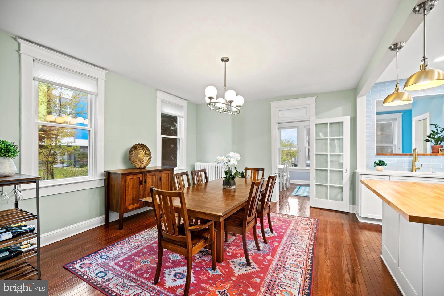 637 Allison Street Northwest Washington, DC 20011 - Photo 7 of 25 a view of a dining room with furniture window and wooden floor