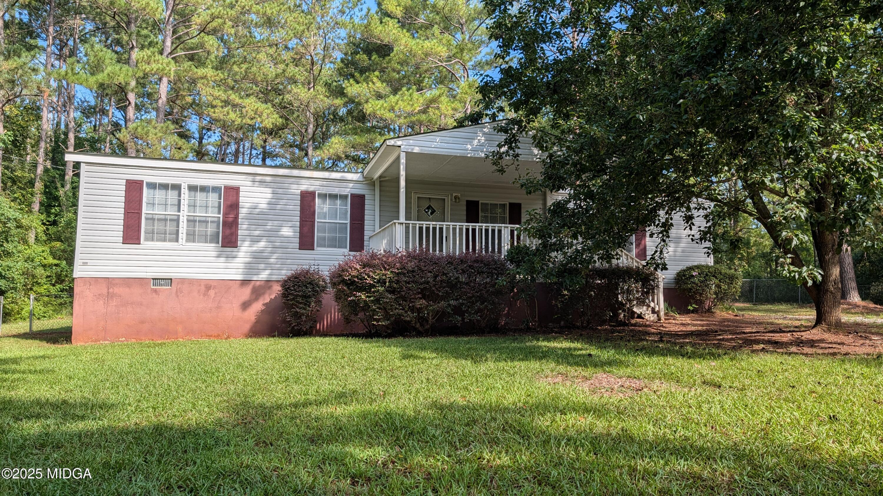 151 Hardy Road Gray, GA 31032 - Photo 1 of 18 a front view of a house with garden