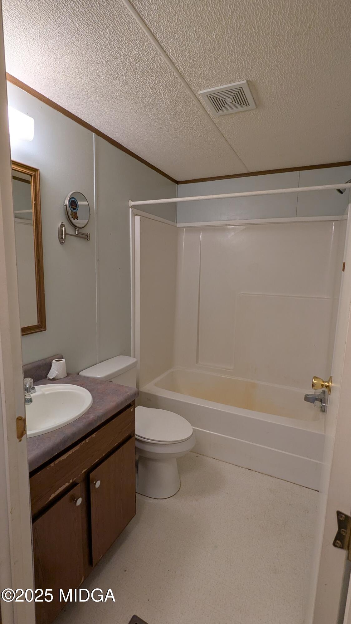 151 Hardy Road Gray, GA 31032 - Photo 12 of 18 a bathroom with a granite countertop sink toilet and shower