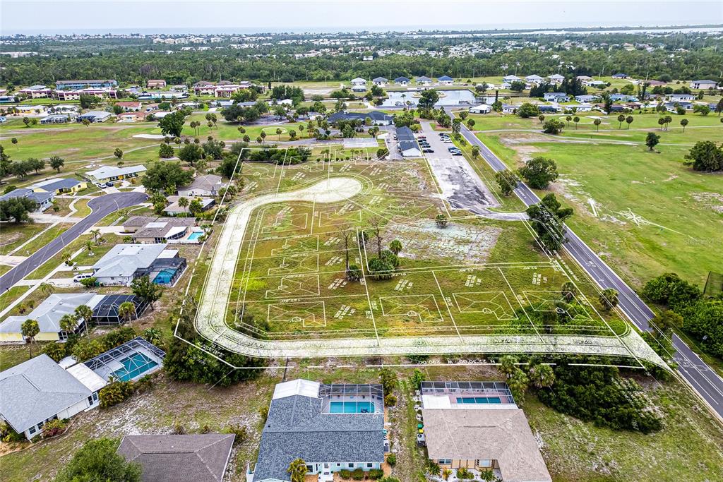 3 Golfview Road Rotonda West, FL 33947 - Photo 11 of 13 an aerial view of residential houses with outdoor space
